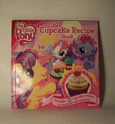 Size: 1458x1563 | Tagged: safe, scootaloo (g3), starsong, sweetie belle (g3), pony, g3.5, book, cupcake, cute cupcake recipe book, food, irl, merchandise, photo