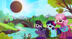 Size: 1000x545 | Tagged: safe, artist:pixelkitties, cheerilee, oc, earth pony, pegasus, pony, 2017 solar eclipse, bow, bridge, clothes, colt, eclipse, eclipse glasses, eyewear, female, filly, glasses, hair bow, jewelry, male, mare, moon, mountain, mountain range, necklace, ponyville park, protective glasses, river, scarf, solar eclipse, sun