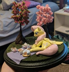 Size: 578x606 | Tagged: safe, artist:blackdawnyaoilover, derpibooru import, fluttershy, pegasus, pony, cake, cookie, craft, cup, food, irl, lying down, on side, photo, picnic, sculpture, solo, teacup, teapot, traditional art