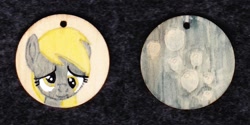 Size: 1024x513 | Tagged: safe, artist:malte279, derpibooru import, derpy hooves, pegasus, pony, craft, cutie mark, female, jewelry, pendant, traditional art, wood