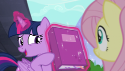 Size: 1280x720 | Tagged: safe, derpibooru import, screencap, fluttershy, twilight sparkle, twilight sparkle (alicorn), alicorn, pegasus, pony, the hooffields and mccolts, book, duo, female, magic, mare