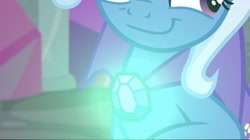 Size: 454x254 | Tagged: safe, artist:disneymarvel96, derpibooru import, edit, edited screencap, screencap, trixie, unicorn, a horse shoe-in, brooch, cape, clasp, close-up, clothes, female, glow, light up, solo, trixie's glowing brooch