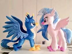 Size: 1024x768 | Tagged: safe, artist:nekokevin, gallus, silverstream, classical hippogriff, griffon, hippogriff, duo, female, irl, lidded eyes, looking at each other, male, photo, plushie, size difference, smiling, spread wings, wings