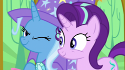 Size: 1280x720 | Tagged: safe, derpibooru import, screencap, starlight glimmer, trixie, pony, unicorn, no second prances, duo, female, mare, one eye closed, twilight's castle, wink