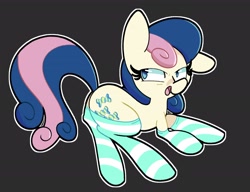 Size: 2500x1923 | Tagged: safe, artist:kindakismet, derpibooru import, bon bon, sweetie drops, earth pony, pony, black background, clothes, ear down, female, lying down, mare, open mouth, prone, simple background, socks, solo, striped socks