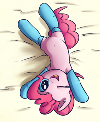 Size: 892x1090 | Tagged: safe, artist:handsockz, derpibooru import, twibooru import, pinkie pie, earth pony, pony, bed, belly button, clothes, cute, deleted from derpibooru, diapinkes, looking at you, on back, one eye closed, open mouth, smiling, socks, solo, wink