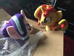 Size: 1200x919 | Tagged: artist needed, safe, artist:dvixie, derpibooru import, twibooru import, starlight glimmer, sunset shimmer, pony, unicorn, box, bubble wrap, deleted from derpibooru, duo, irl, looking at each other, photo, plushie, pony in a box