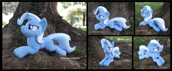 Size: 4237x1754 | Tagged: safe, artist:peruserofpieces, derpibooru import, trixie, pony, unicorn, beanie (plushie), cocky, female, horn, irl, looking at you, lying down, mare, photo, plushie, prone, smiling, smiling at you, solo, sploot, tree