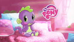 Size: 640x360 | Tagged: safe, spike, dragon, human, animated, baby dragon, baby spike, bedroom, blushing, commercial, diaper, hands on face, hasbro logo, irl, merchandise, mp4, my little pony logo, official, open mouth, toy
