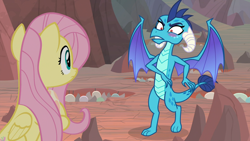 Size: 1920x1080 | Tagged: safe, screencap, fluttershy, princess ember, dragon, pegasus, pony, sweet and smoky, blushing, dragon egg, dragoness, duo, egg, faic, female, holding a dragon, holding an egg, hoof hold, looking at each other, mare, out of context, shrunken pupils, spread wings
