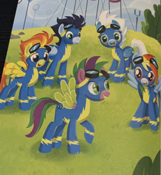 Size: 802x870 | Tagged: safe, artist:anthony conley, derpibooru import, fleetfoot, rainbow dash, soarin', spike, spitfire, pegasus, pony, a pony named spike, book, clothes, outdoors, ponified, ponified spike, species swap, uniform, wonderbolts, wonderbolts uniform