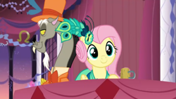 Size: 1397x786 | Tagged: safe, derpibooru import, screencap, discord, fluttershy, pony, make new friends but keep discord, season 5, bowtie, clothes, dress, female, gala dress, grand galloping gala, hat, male, mug, screenshots, table, top hat