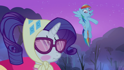Size: 1280x720 | Tagged: safe, derpibooru import, screencap, rainbow dash, rarity, pegasus, pony, unicorn, season 3, sleepless in ponyville, blushing, camping outfit, clothes, duo, duo female, female, flying, glasses, mare, night, open mouth, scrunchy face