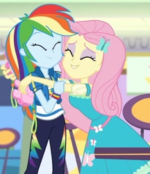 Size: 1453x1680 | Tagged: safe, derpibooru import, screencap, fluttershy, rainbow dash, better together, equestria girls, holidays unwrapped, clothes, cropped, cute, daaaaaaaaaaaw, dashabetes, dashing through the mall, eyes closed, eyeshadow, female, geode of fauna, geode of super speed, hairpin, happy, heartwarming, hug, magical geodes, makeup, pants, pink camera, precious, shipping fuel, shyabetes, smiling, sweet dreams fuel