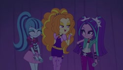 Size: 1266x719 | Tagged: safe, derpibooru import, screencap, adagio dazzle, aria blaze, sonata dusk, equestria girls, rainbow rocks, disguise, disguised siren, eyes closed, female, gem, microphone, siren gem, the dazzlings