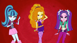 Size: 1397x786 | Tagged: safe, derpibooru import, screencap, adagio dazzle, aria blaze, sonata dusk, equestria girls, rainbow rocks, arm behind head, battle of the bands, dreamworks face, female, grin, looking at you, smiling, smiling at you, the dazzlings, trio, trio female, youtube link