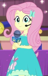 Size: 384x609 | Tagged: safe, derpibooru import, screencap, fluttershy, best in show: the victory lap, better together, equestria girls, beautiful, clothes, cute, cutie mark, cutie mark on clothes, dress, dress interior, geode of fauna, looking at you, magical geodes, microphone, shyabetes, smiling, smiling at you