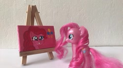 Size: 750x421 | Tagged: safe, artist:lillycloudart, derpibooru import, pinkie pie, earth pony, pony, canvas, female, grin, irl, mare, photo, smiling, toy, traditional art