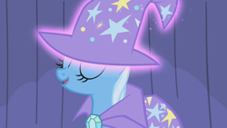 Size: 1920x1080 | Tagged: safe, derpibooru import, screencap, trixie, pony, unicorn, boast busters, cape, clothes, eyes closed, female, hat, levitation, magic, magic aura, mare, open mouth, solo, telekinesis, trixie's cape, trixie's hat