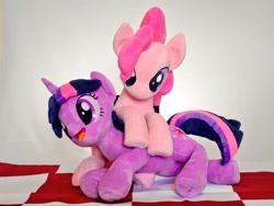 Size: 1024x768 | Tagged: safe, artist:nekokevin, pinkie pie, twilight sparkle, unicorn twilight, earth pony, pony, unicorn, duo, female, frog (hoof), irl, mare, on top, open mouth, photo, picnic blanket, plushie, smiling, underhoof