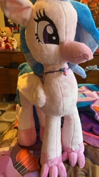 Size: 1980x3520 | Tagged: safe, artist:mezairplush, derpibooru import, photographer:savygriffs, silverstream, hippogriff, bed, female, irl, jewelry, necklace, photo, plushie