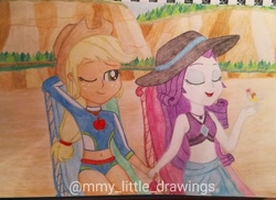 Size: 1080x786 | Tagged: safe, artist:mmy_little_drawings, derpibooru import, applejack, rarity, better together, equestria girls, arm behind head, clothes, eyes closed, female, hat, holding hands, lesbian, one eye closed, outdoors, rarijack, shipping, sitting, sun hat, swimsuit, traditional art, watermark, wink