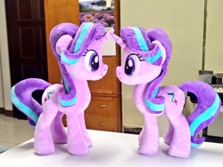 Size: 1024x768 | Tagged: safe, artist:nekokevin, starlight glimmer, pony, unicorn, series:nekokevin's glimmy, duo, female, irl, looking at each other, mare, photo, plushie, self ponidox, size difference, smiling, table