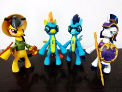 Size: 4032x3024 | Tagged: safe, derpibooru import, daring do, shining armor, soarin', spitfire, pegasus, unicorn, armor, guardians of harmony, hat, irl, photo, shield, standing, toy, wonderbolts