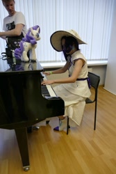 Size: 1067x1600 | Tagged: safe, derpibooru import, rarity, human, 2021, clothes, cosplay, costume, cyrillic, irl, irl human, musical instrument, newbronycon, photo, piano, plushie, rubronycon, russian