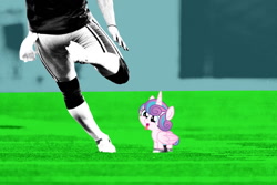 Size: 1200x800 | Tagged: safe, princess flurry heart, human, abuse, american football, flurrybuse, football field, irl, irl human, kicking, op is a cuck, photo, sports, tongue, tongue out