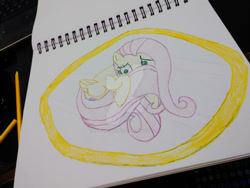 Size: 400x300 | Tagged: safe, artist:dougtheloremaster, derpibooru import, fluttershy, pegasus, pony, deviantart watermark, frightened, hiding behind tail, nervous, obtrusive watermark, pencil, pencil drawing, photo, scared, sketchpad, timid, traditional art, watermark