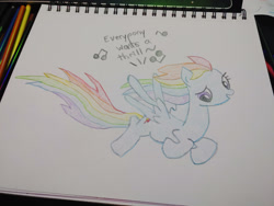 Size: 1280x960 | Tagged: safe, artist:dougtheloremaster, derpibooru import, rainbow dash, pegasus, pony, don't stop believing, flying, journey, looking down, pencil, pencil drawing, photo, singing, sketchpad, solo, song reference, traditional art, windswept mane