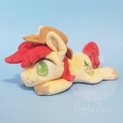 Size: 1000x1000 | Tagged: safe, artist:appledew, derpibooru import, bright mac, earth pony, pony, beanie (plushie), chibi, happy, hat, irl, male, photo, plushie, prone, smiling, solo, stallion, unshorn fetlocks