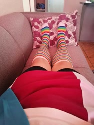 Size: 563x750 | Tagged: safe, derpibooru import, photographer:mr.sparkle, rainbow dash, human, equestria girls, bike shorts, clothes, cosplay, costume, crossdressing, crossplay, irl, irl human, legs, photo, rainbow socks, skirt, socks, sofa, solo, stocking feet, striped socks