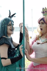 Size: 1365x2048 | Tagged: safe, artist:maddymoiselle, artist:sarahndipity cosplay, artist:silverscotty photography, derpibooru import, princess cadance, queen chrysalis, human, 2017, clothes, cosplay, costume, facebook, irl, irl human, looking at each other, open mouth, photo