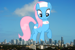 Size: 2794x1871 | Tagged: safe, artist:sierraex, derpibooru import, lotus blossom, earth pony, pony, female, florida, giant pony, giant/macro earth pony, giantess, high res, highrise ponies, irl, macro, mare, mega giant, miami, photo, ponies in real life, raised hoof, raised leg, smiling, solo