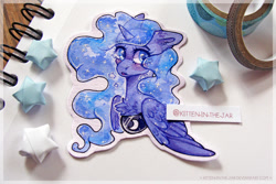 Size: 1024x683 | Tagged: safe, artist:kitten-in-the-jar, derpibooru import, princess luna, alicorn, pony, bust, chest fluff, colored pupils, crying, cute, cutout, ear fluff, ears, lunabetes, origami, photo, solo, stars, traditional art, watercolor painting