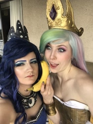 Size: 1538x2048 | Tagged: safe, artist:sarahndipity cosplay, derpibooru import, princess celestia, princess luna, human, banana, bare shoulders, clothes, cosplay, costume, do you like bananas?, everfree northwest, everfree northwest 2018, food, irl, irl human, luna is not amused, open mouth, photo, unamused