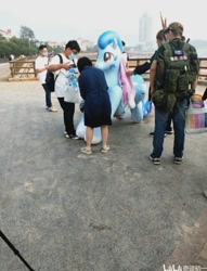 Size: 720x944 | Tagged: safe, derpibooru import, oc, oc:lyre wave, human, china, inflatable toy, irl, irl human, photo, qingdao, qingdao brony festival