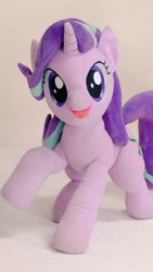 Size: 576x1024 | Tagged: safe, artist:nekokevin, starlight glimmer, pony, unicorn, series:nekokevin's glimmy, female, irl, looking at you, mare, open mouth, photo, plushie, raised hoof, raised leg, smiling, solo, starlight glimmer plushie