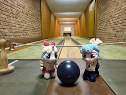 Size: 4032x3024 | Tagged: safe, artist:xeto_de, derpibooru import, cozy glow, oc, oc:lily allure, bell, bowling alley, bowling ball, bowling pin, brick wall, irl, photo, plushie
