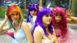 Size: 700x394 | Tagged: safe, artist:dust-bunny, derpibooru import, pinkie pie, rainbow dash, rarity, twilight sparkle, human, clothes, cosplay, costume, irl, irl human, jewelry, necklace, otakon, otakon 2012, photo, tongue, tongue out