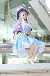 Size: 2000x3000 | Tagged: safe, artist:mieucosplay, artist:notsoprophoto, derpibooru import, trixie, human, bronycon, bronycon 2017, cape, clothes, cosplay, costume, hat, irl, irl human, photo, sitting, trixie's cape, trixie's hat