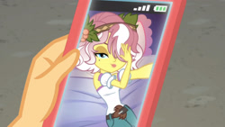 Size: 3410x1920 | Tagged: safe, derpibooru import, screencap, applejack, vignette valencia, better together, equestria girls, rollercoaster of friendship, cellphone, female, hair over one eye, high res, looking at you, phone, pillow, smartphone, smiling, smiling at you, solo focus