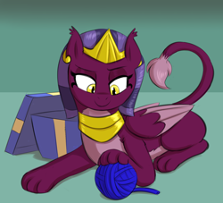 Size: 2684x2436 | Tagged: safe, artist:heretichesh, derpibooru import, sphinx (character), sphinx, behaving like a cat, colored, eyelashes, female, folded wings, gift box, leonine tail, lidded eyes, looking down, lying down, paws, prone, raised tail, simple background, smiling, solo, tail, wings, yarn, yarn ball