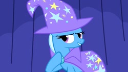 Size: 1280x720 | Tagged: safe, derpibooru import, screencap, trixie, pony, unicorn, boast busters, cape, curtain, female, hat, hoof on chest, mare, solo, trixie's cape, trixie's hat