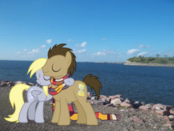 Size: 2048x1536 | Tagged: safe, derpibooru import, derpy hooves, doctor whooves, earth pony, pegasus, pony, background pony, bismarck, clothes, doctorderpy, eyes closed, female, folded wings, hug, irl, male, mare, north dakota, photo, ponies in real life, scarf, shipping, smiling, stallion, straight, wings