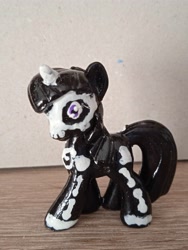 Size: 3120x4160 | Tagged: safe, derpibooru import, photographer:assertiveshypony, oc, oc only, unicorn, blind bag pony, bone, clothes, costume, halloween, halloween costume, holiday, photo, repaint, skeleton