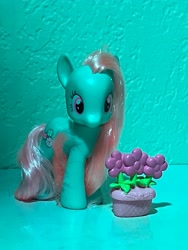 Size: 3024x4032 | Tagged: safe, derpibooru import, minty, a very minty christmas, g3, accessories, best pony, brushable, figurine, flower, flower pot, goddess, hair, photo, picture, simple background, teal background, toy