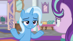 Size: 1764x993 | Tagged: safe, derpibooru import, screencap, starlight glimmer, trixie, pony, unicorn, a horse shoe-in, duo, duo female, female, frown, grin, lidded eyes, looking at each other, looking at someone, mare, shrug, smiling